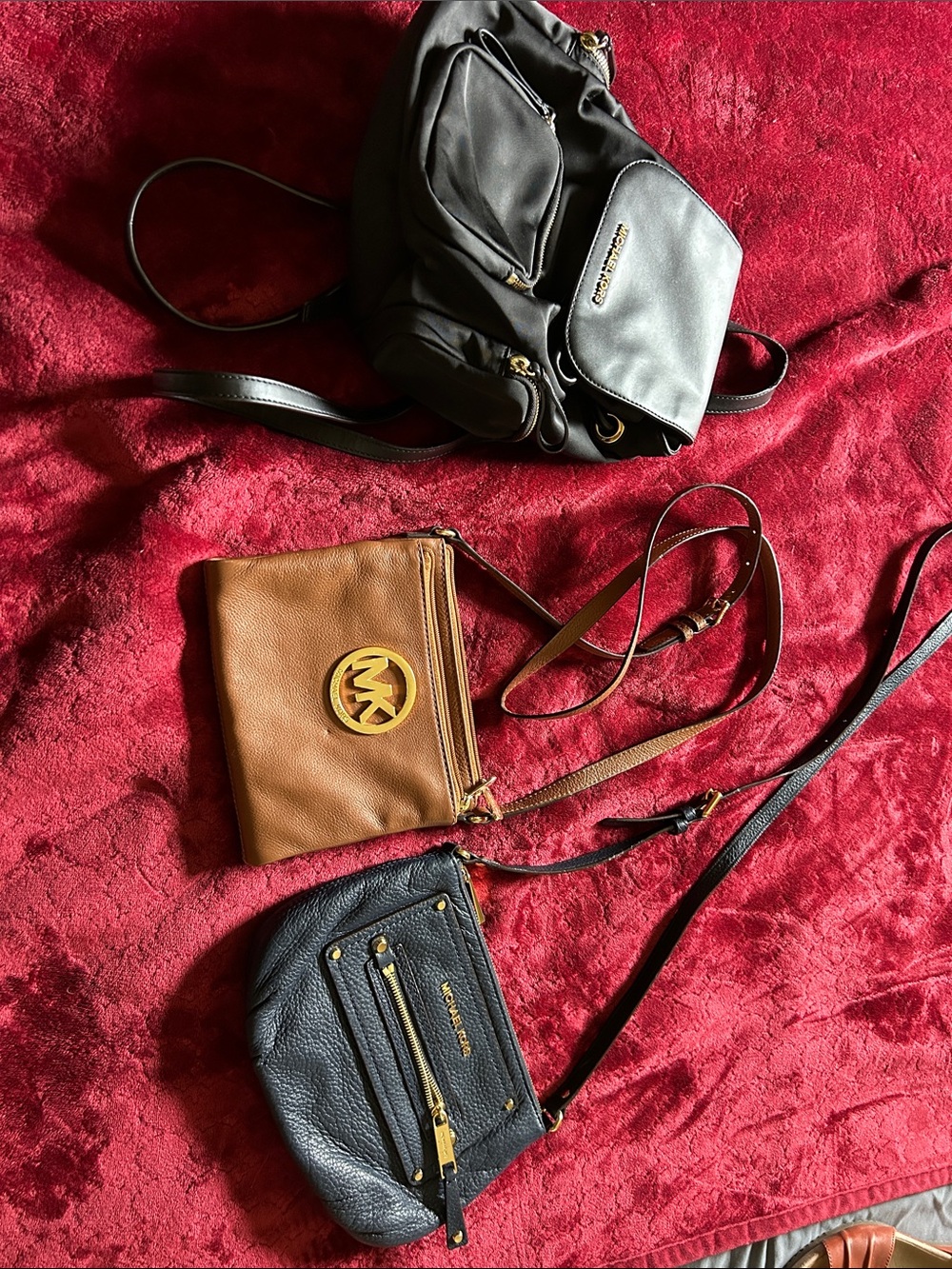 Michael  lot of 3 bags 2 crossbody and one backpack with Gold Hardware
